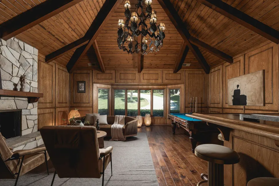The timber-lined billiard room